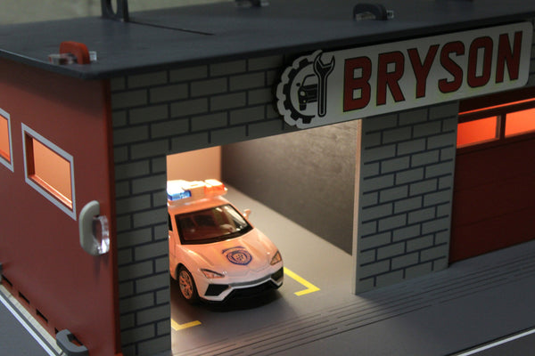 Toy garage with sectiona roll-up doors and garage door opener, toy car storage, toy car service station