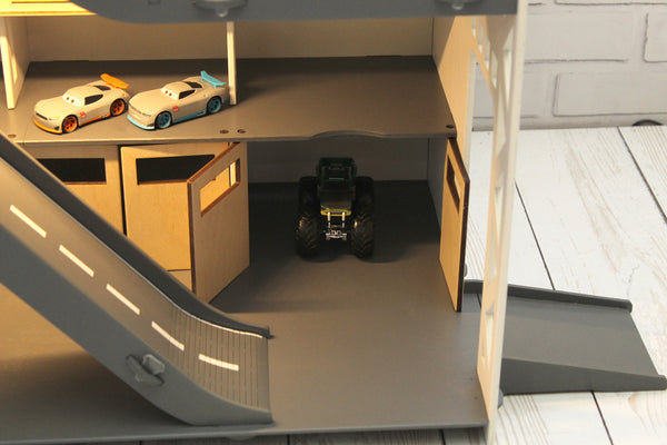 Toy car garage with a toy car wash, doors, gates and mutiple ramps in white