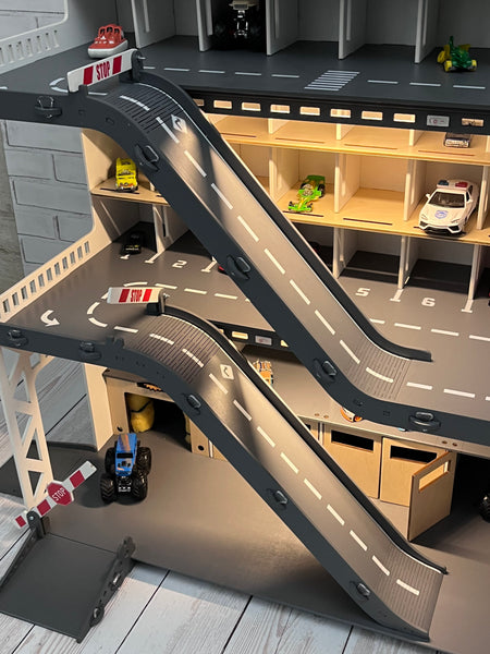 Toy car garage with a toy car wash, doors, gates and mutiple ramps