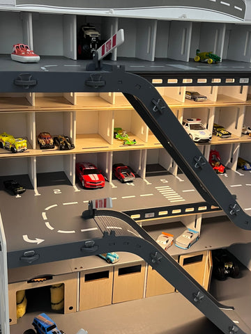Toy car garage with a toy car wash, doors, gates and mutiple ramps